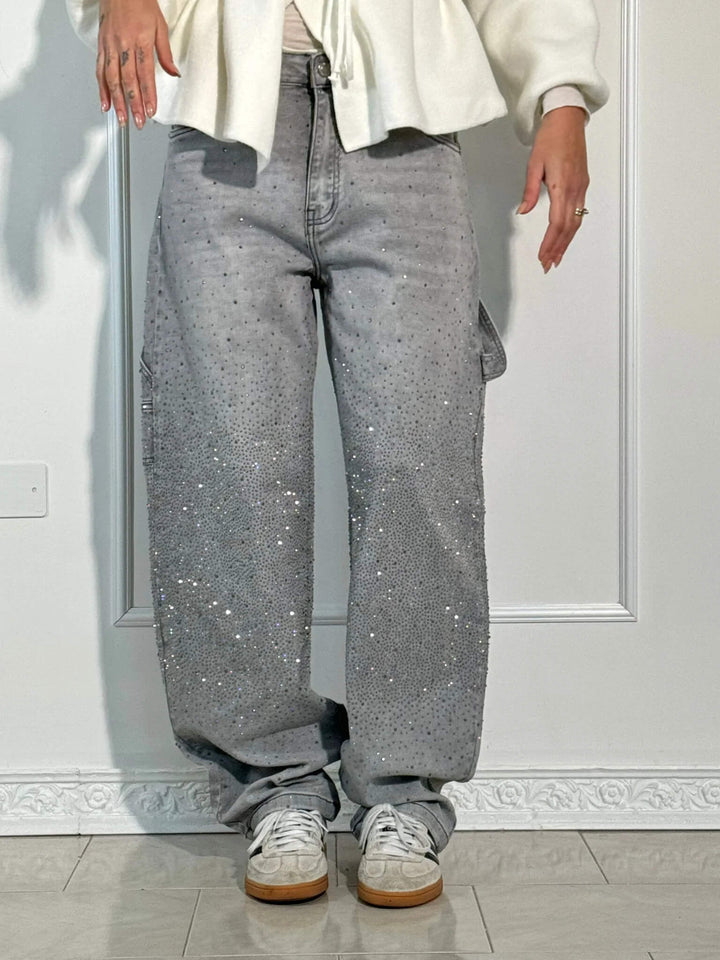 Gray speckled denim trousers with cargo-style side pockets and straight legs