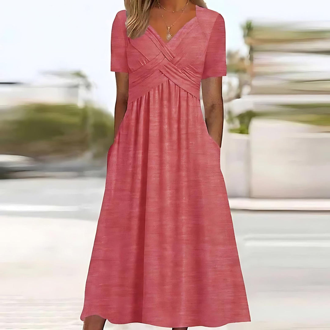 Rose pink midi dress with V-neck, short sleeves, and ruched waist detail