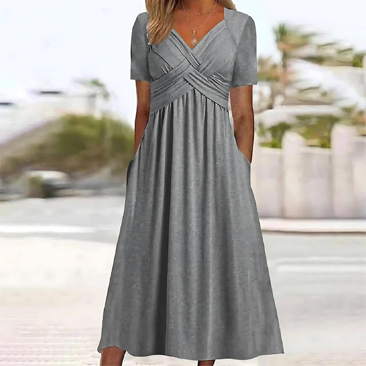 Gray midi dress with V-neck, short sleeves, and ruched crossover waist