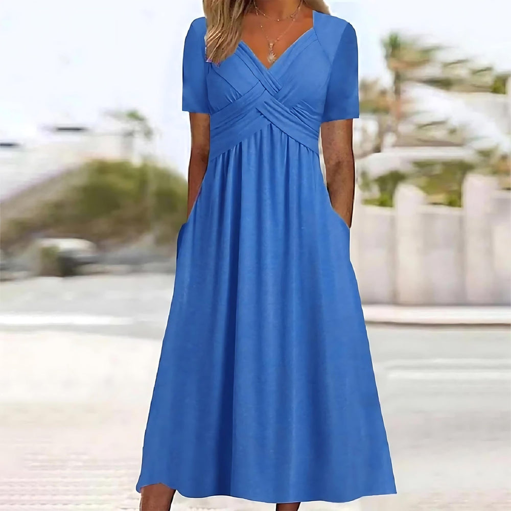 Blue midi dress with V-neck, short sleeves, and ruched crossover waist