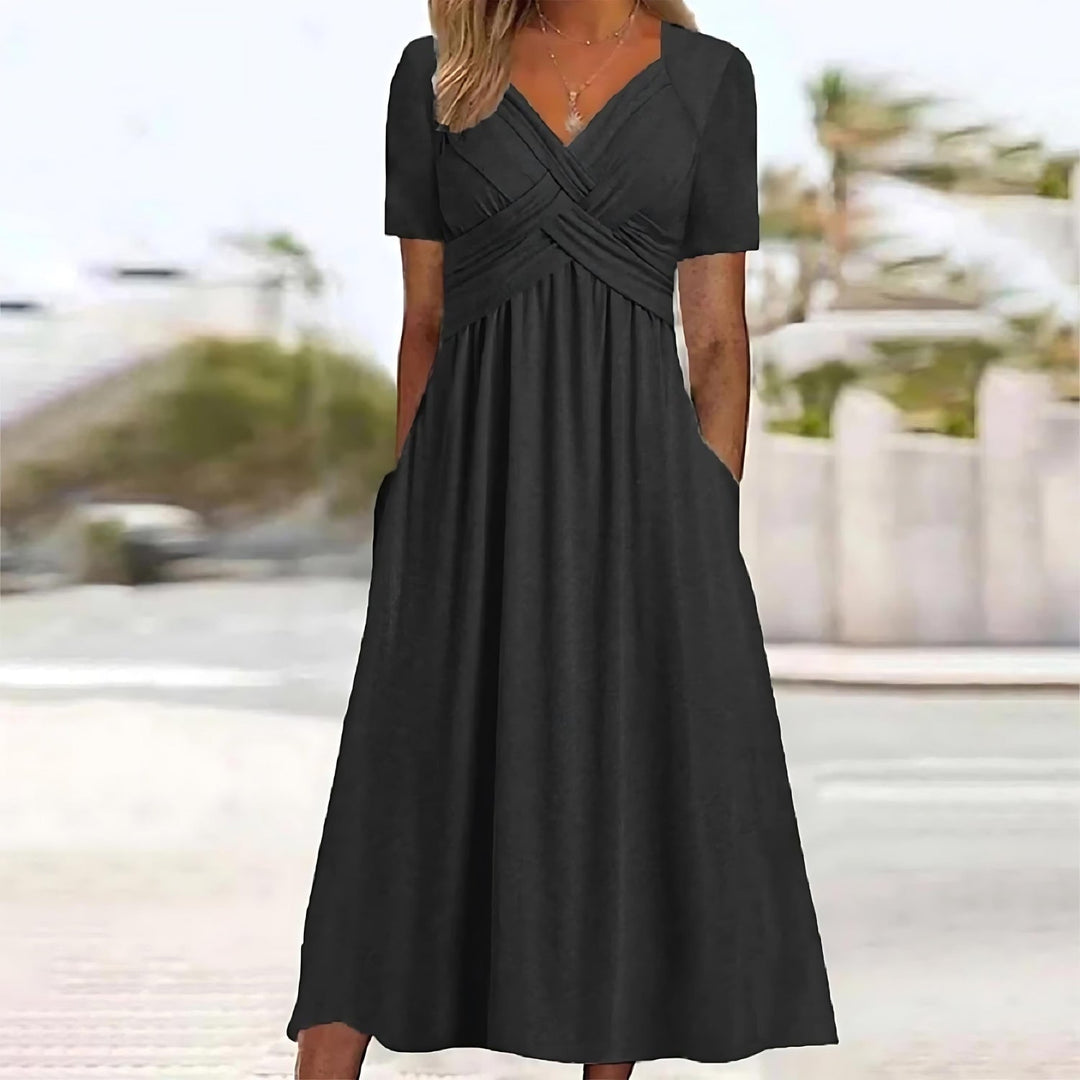 Black midi dress with V-neck, short sleeves, and ruched crossover waist