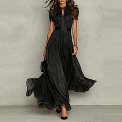 Black chiffon maxi dress with puff sleeves, keyhole neckline, pleated waist, flared skirt