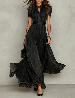 Black chiffon maxi dress with puff sleeves, keyhole neckline, pleated waist, flared skirt