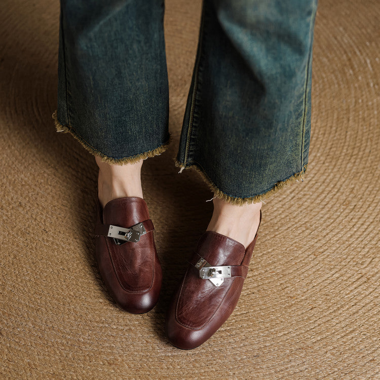 Maroon leather mules with square silver buckle hardware and slip-on design