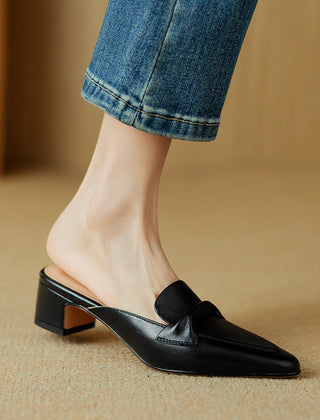 Black leather pointed-toe mule with bow-style vamp strap and low block heel