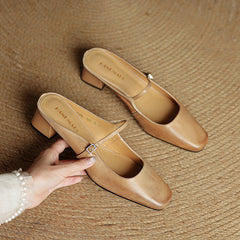 Pair of apricot leather mules with side buckle strap and square low block heel