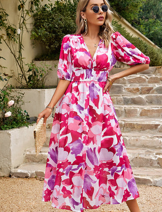 Pink and white floral midi dress with puff sleeves, V-neck, and gathered waist