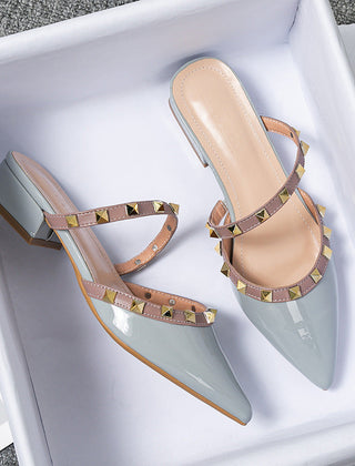 Light blue stud-strap mules with pointed toe and low block heel, side buckle detail