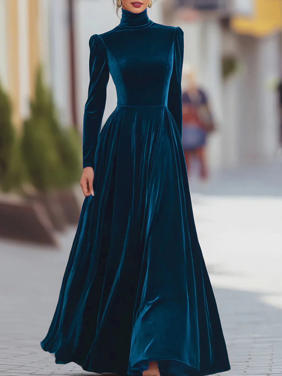 Blue velvet dress with high neck, long sleeves, fitted bodice, flared skirt