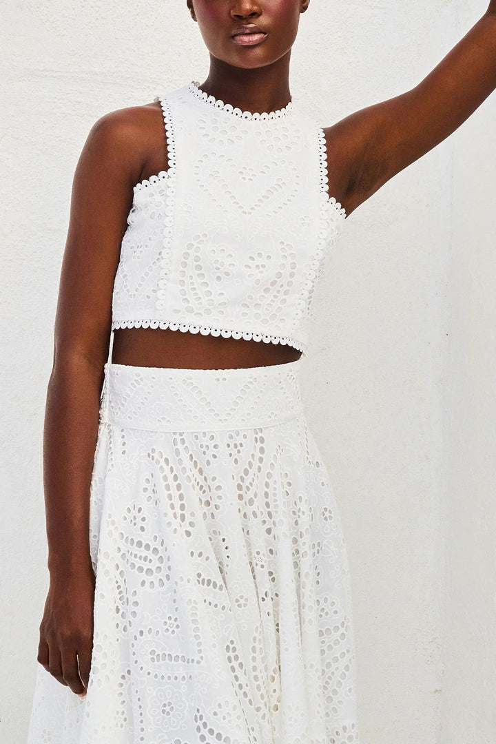 Women’s eyelet sleeveless two-piece dress set in white, cropped top and long skirt.