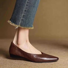 Brown leather pointed-toe mule flats with low heel and slip-on fit