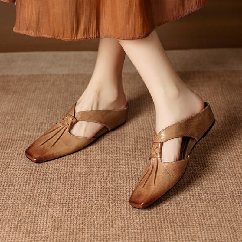 Brown square-toe genuine leather mules with front cutout strap and flat sole.