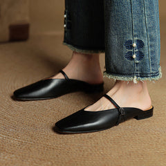 Miral genuine leather mules in black, pointed slip-on flats with thin sling strap