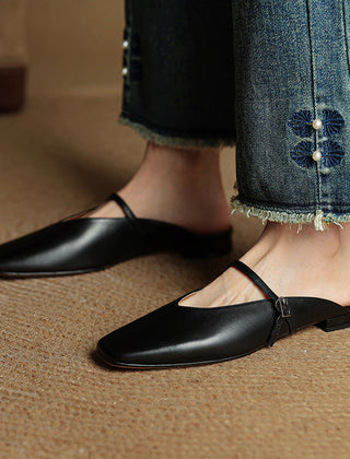 Miral genuine leather mules in black, pointed slip-on flats with thin sling strap