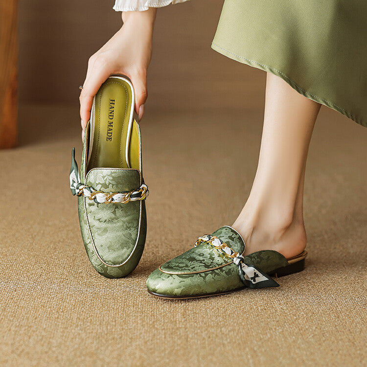 Green genuine leather mules with floral print and knotted bow chain detail, flat slip-on