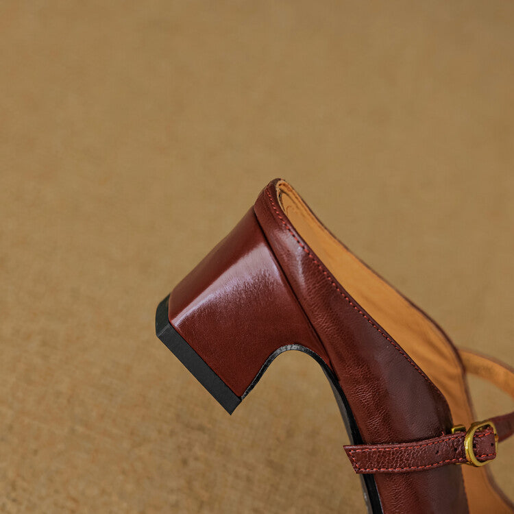 Maroon leather mule with low block heel and adjustable strap with gold buckle detail.