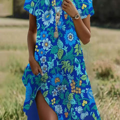 Bright blue short-sleeve midi dress with floral and leaf print, V-neck and side slit