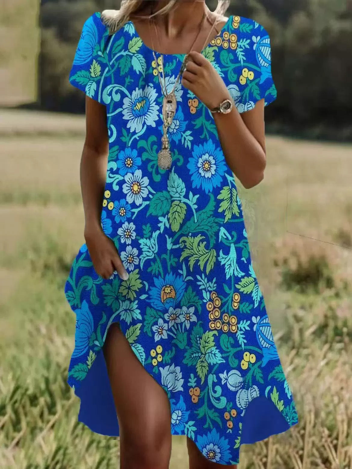 Bright blue short-sleeve midi dress with floral and leaf print, V-neck and side slit