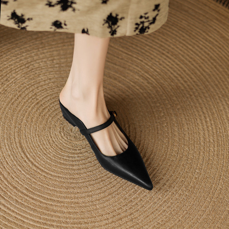 Black genuine leather mule on foot, sling strap with gold buckle, pointed toe.