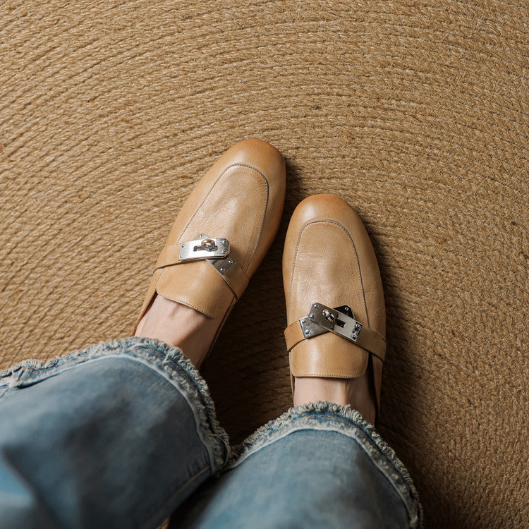 Tan leather mules with square toe and metallic buckle strap detail