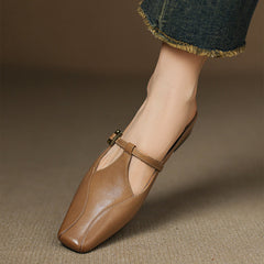 Brown leather mules with open heel, sling strap with gold buckle, low block heel