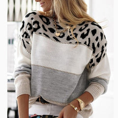 Color block knit sweater with leopard-print yoke and white, gray, and black panels