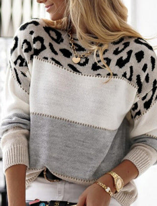 Color block knit sweater with leopard-print yoke and white, gray, and black panels
