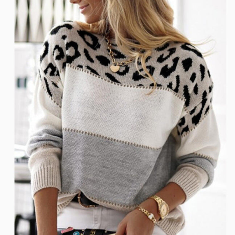 Color block knit sweater with leopard-print yoke and white, gray, and black panels