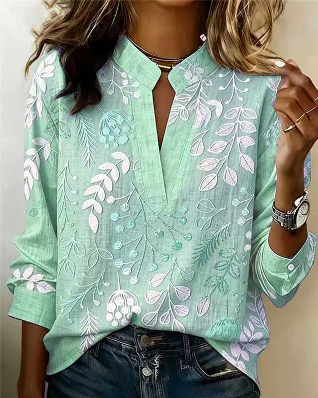Sage green embroidered popover blouse with V-neck and 3/4 sleeves, vine and leaf embroidery
