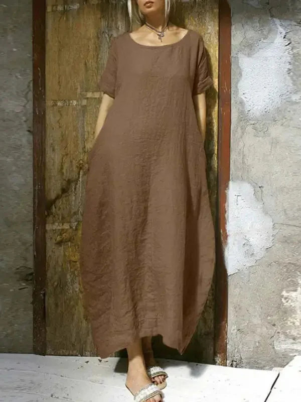 Brown casual maxi dress with short sleeves and round neckline, relaxed long length