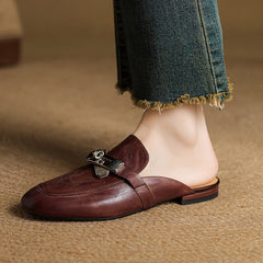 Maroon genuine leather mule with buckled strap and low flat sole