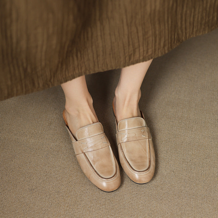 Pair of beige leather mules with slip-on vamp and stitched detail
