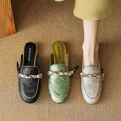 Set of leather mules in black, green, and beige with bow-chain detail, flat slip-on