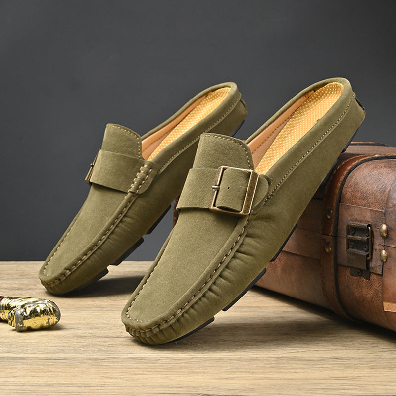 Pair of green suede mules with metal buckle strap and stitched edges