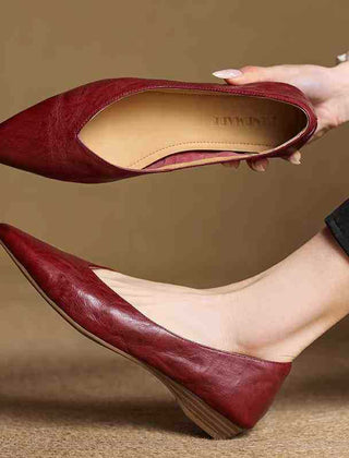 Maroon leather pointed-toe mule flats with open top and low stacked heel