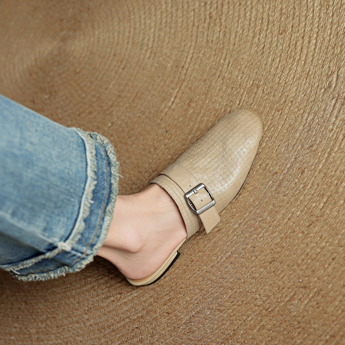 Beige leather mules with square buckle strap and closed toe