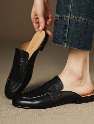 Black leather mule with slip-on strap vamp and low flat sole
