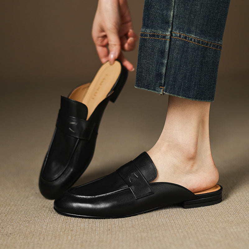 Black leather mule with slip-on strap vamp and low flat sole