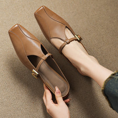 Brown leather mules with gold buckle sling strap, open heel and stitched square toe