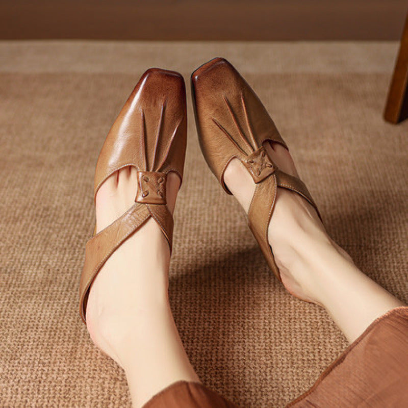 Tan and brown square-toe genuine leather mules with decorative strap detail.