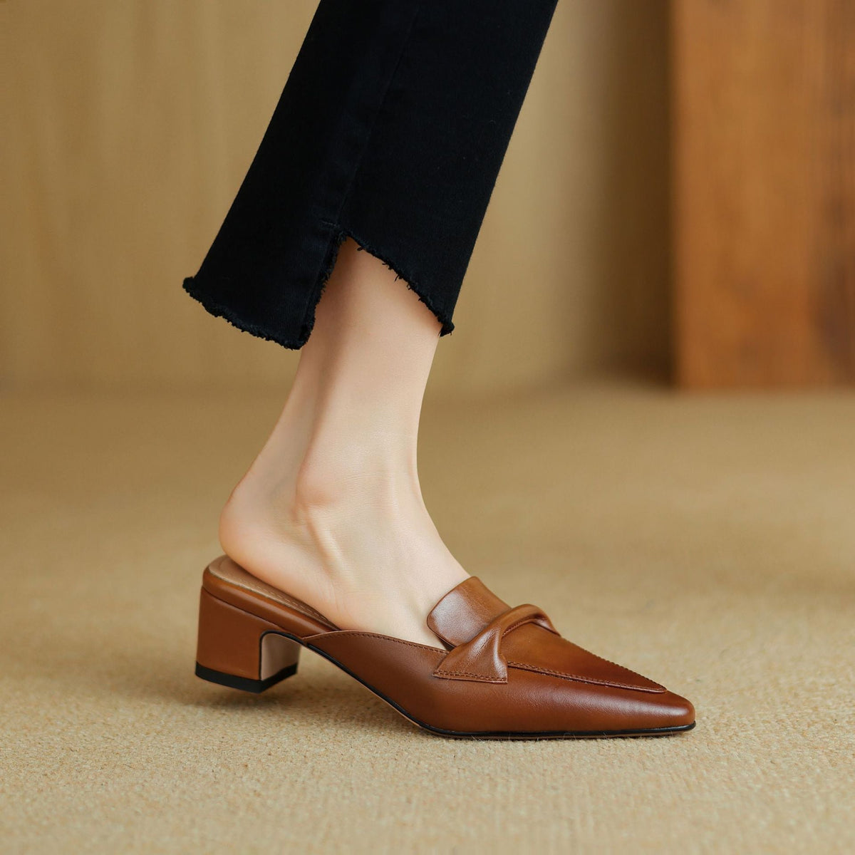 Brown leather slip-on mule with square toe and chunky low heel, side view