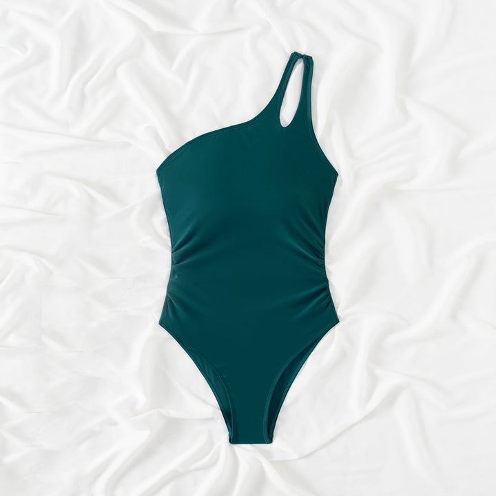 Dark green one-shoulder one-piece swimsuit with small keyhole strap detail