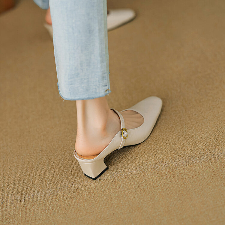 Beige leather mule from back angle with low block heel and ankle strap.