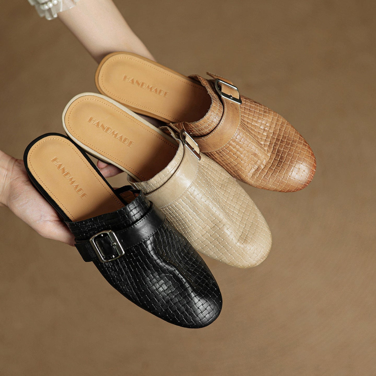 Genuine leather mules with buckles in black, cream, and tan finishes