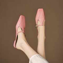 Pink leather mules, open-heel silhouette with sling strap and gold buckle detail