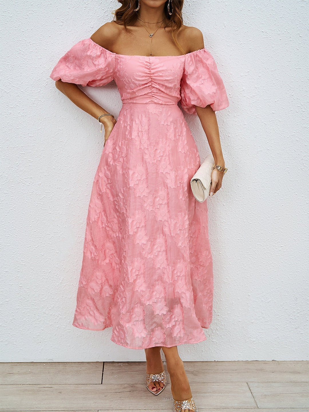 Pink off-shoulder midi dress with puff sleeves and ruched center bodice detail