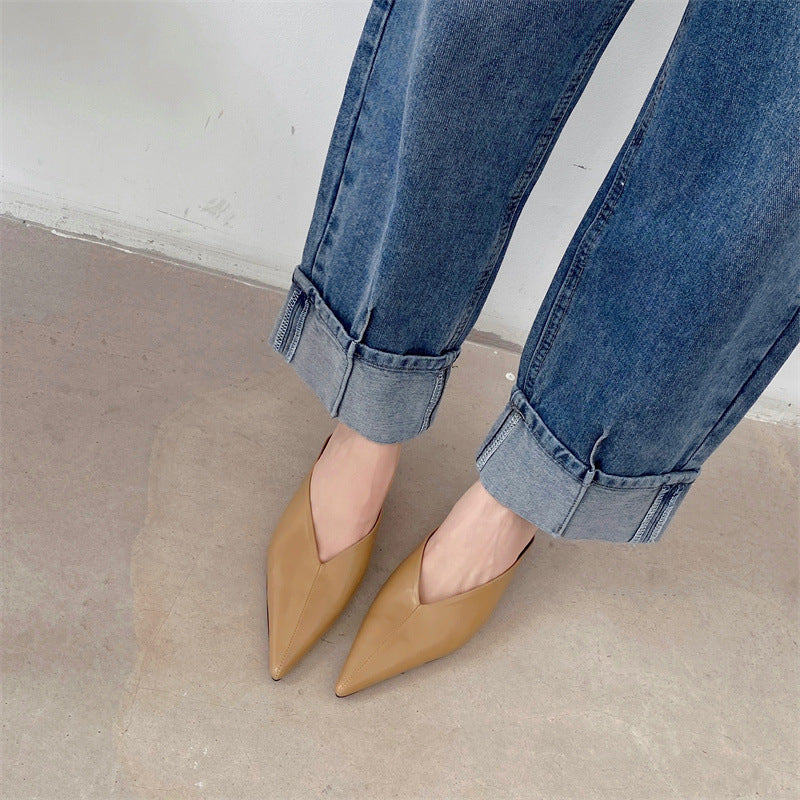 Beige pointed-toe mules with low heel and slip-on design