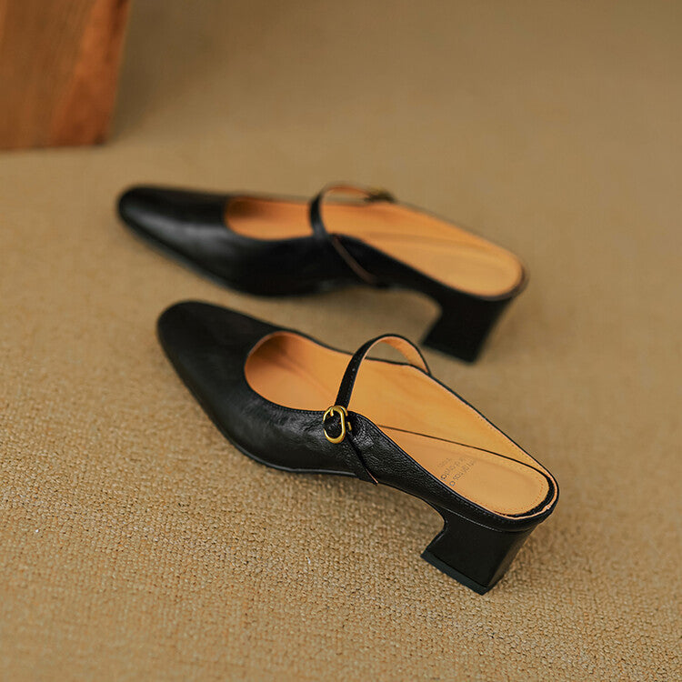 Black leather mules from top view: slip-on with buckle strap and block heel