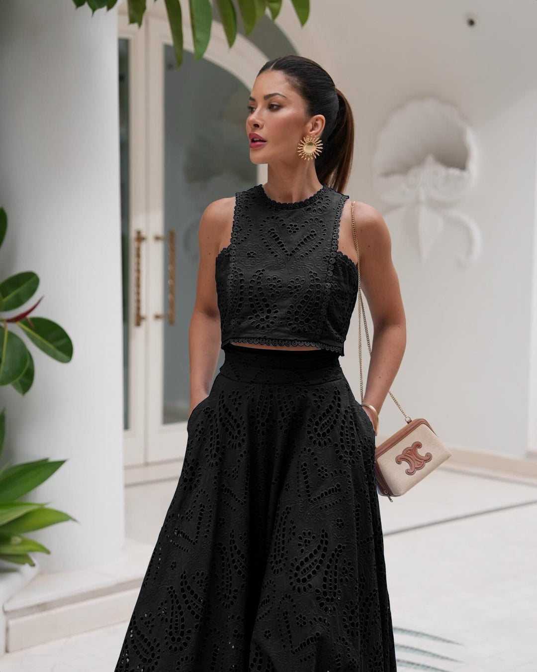 Women’s black eyelet set dress with sleeveless high neck bodice and full skirt