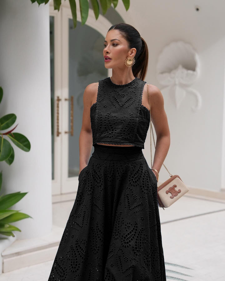 Women’s black eyelet set dress with sleeveless high neck bodice and full skirt